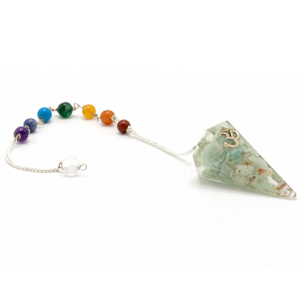 Chakra stone pendulum with colorful beads on a white background