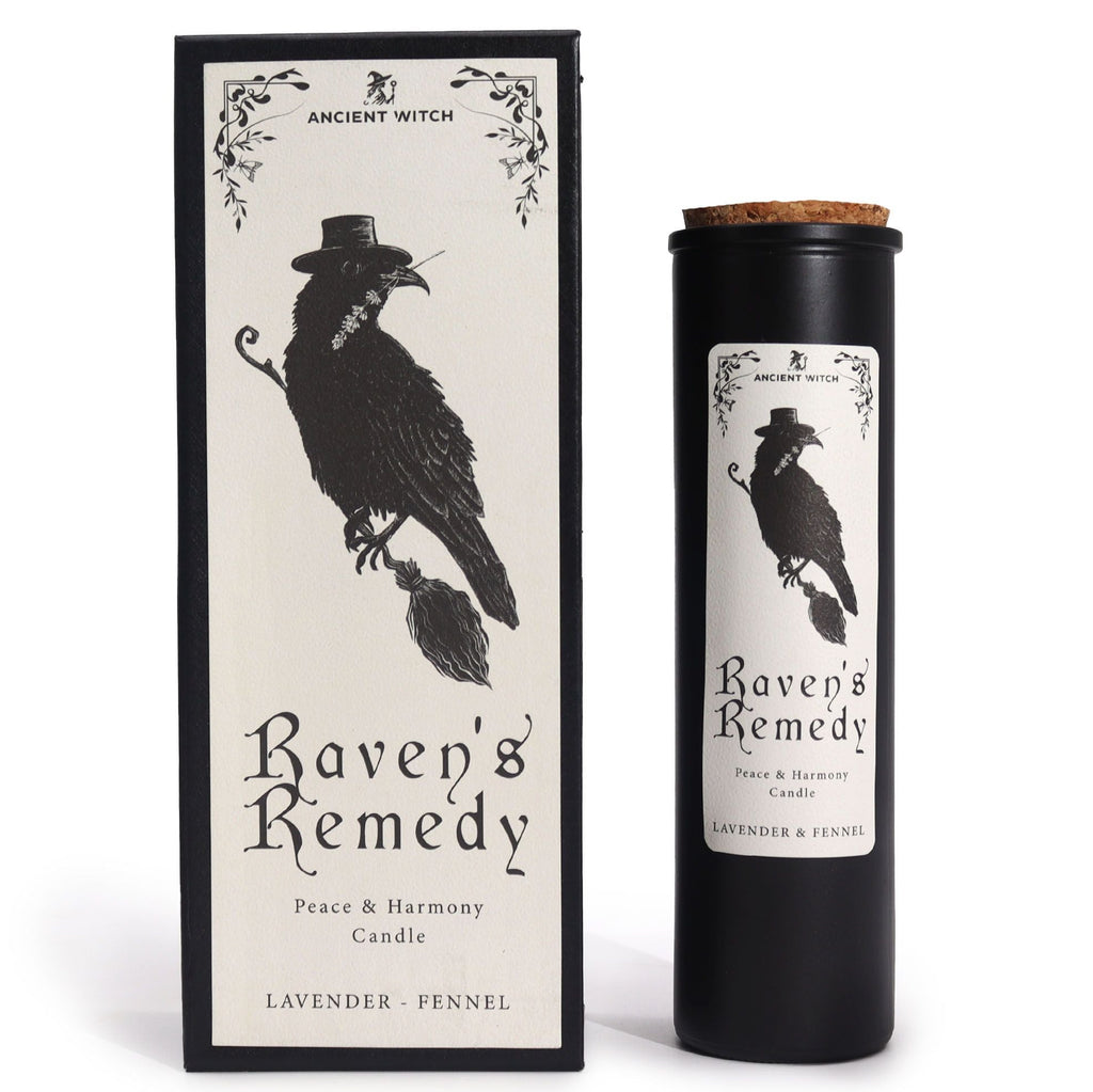 Candle labeled 'Raven's Remedy' with packaging featuring a black bird design on a white background.