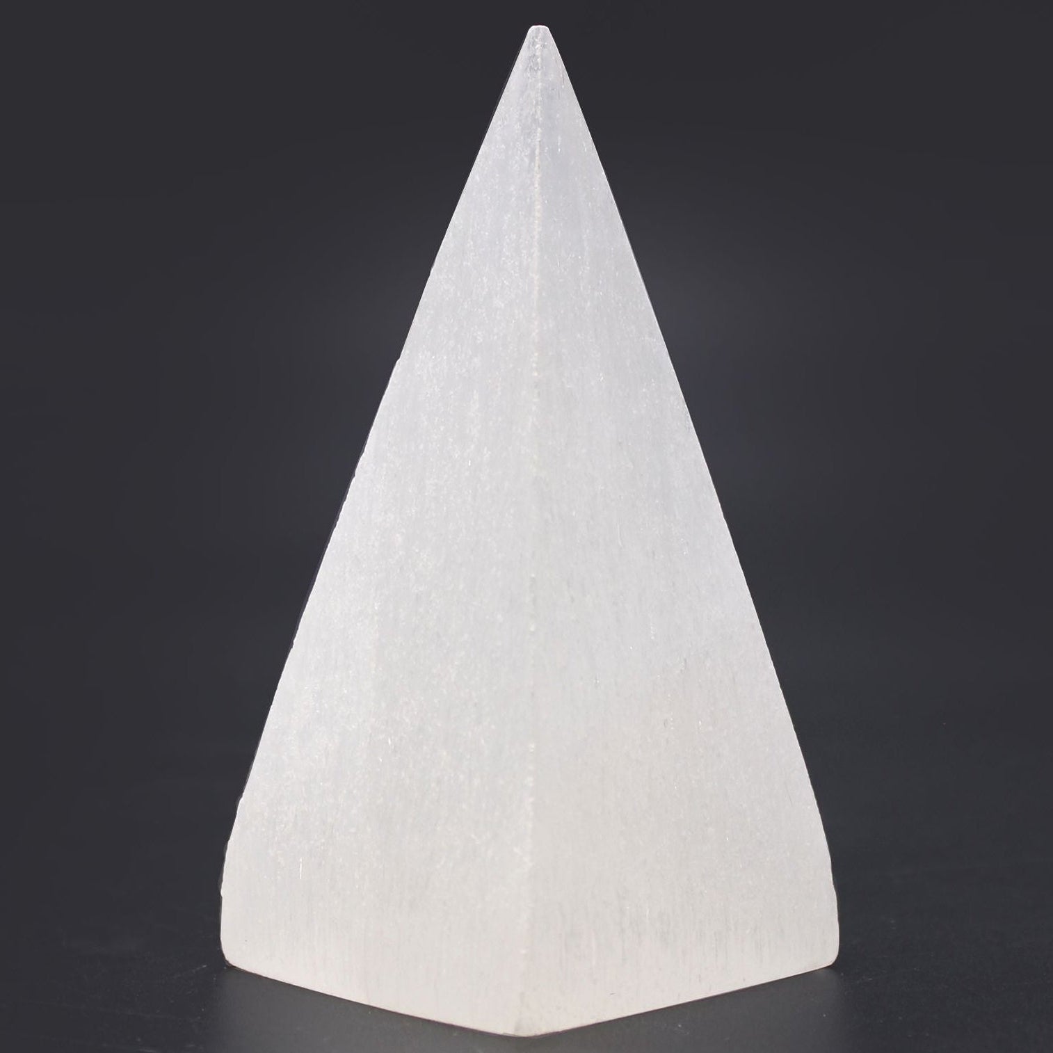 White textured cone-shaped object on a black background