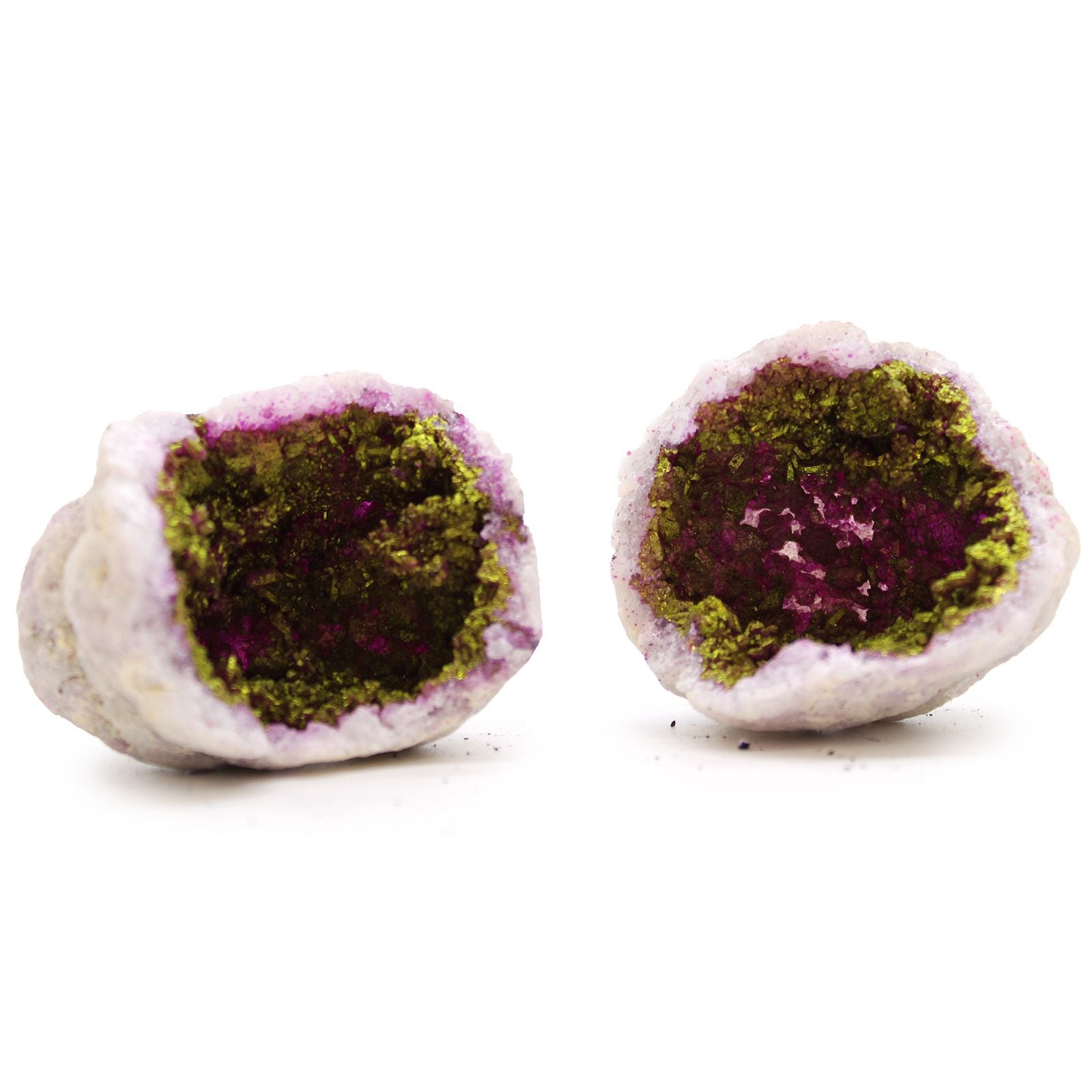 Two mineral specimens with purple and green interior on a white background
