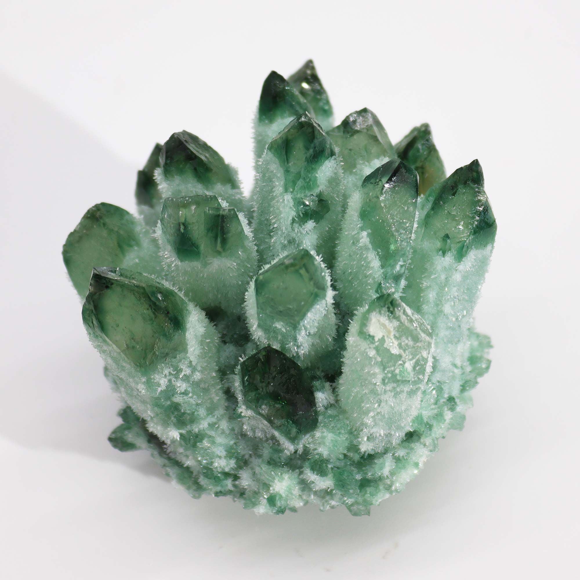 Green crystal rock on a white background