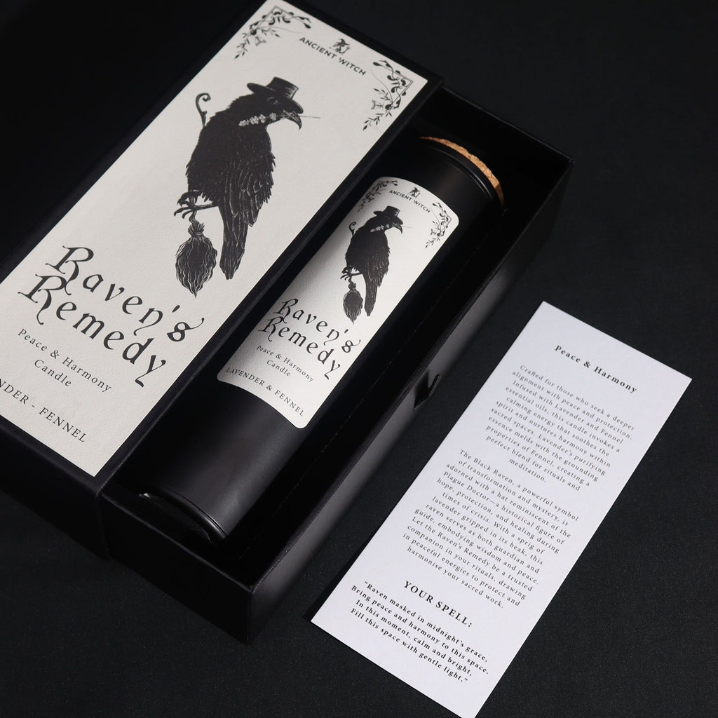 Candle packaging with 'Raven's Remedy' branding on a black background