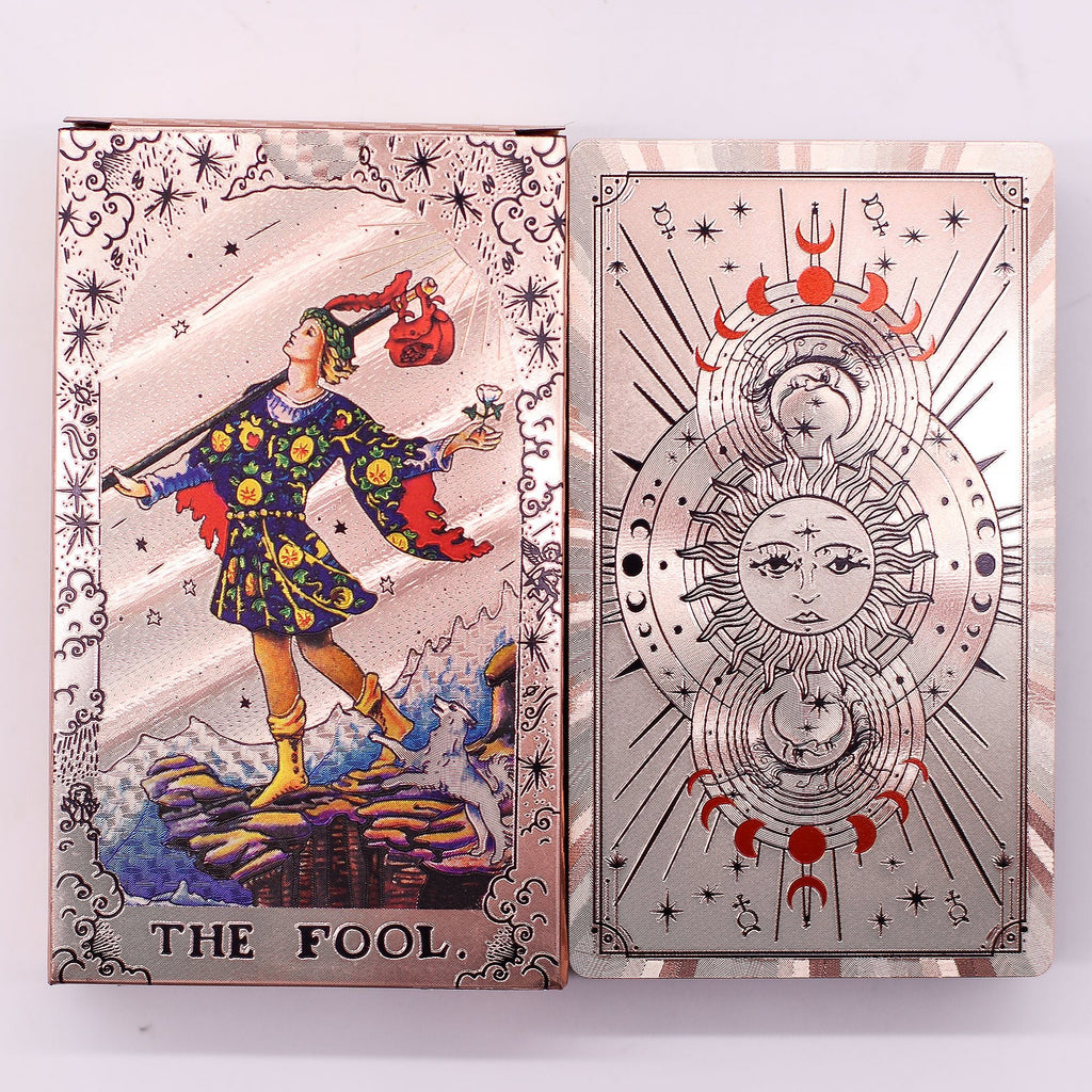 Two tarot cards, 'The Fool' on the left and a decorative card with celestial design on the right, on a white background.