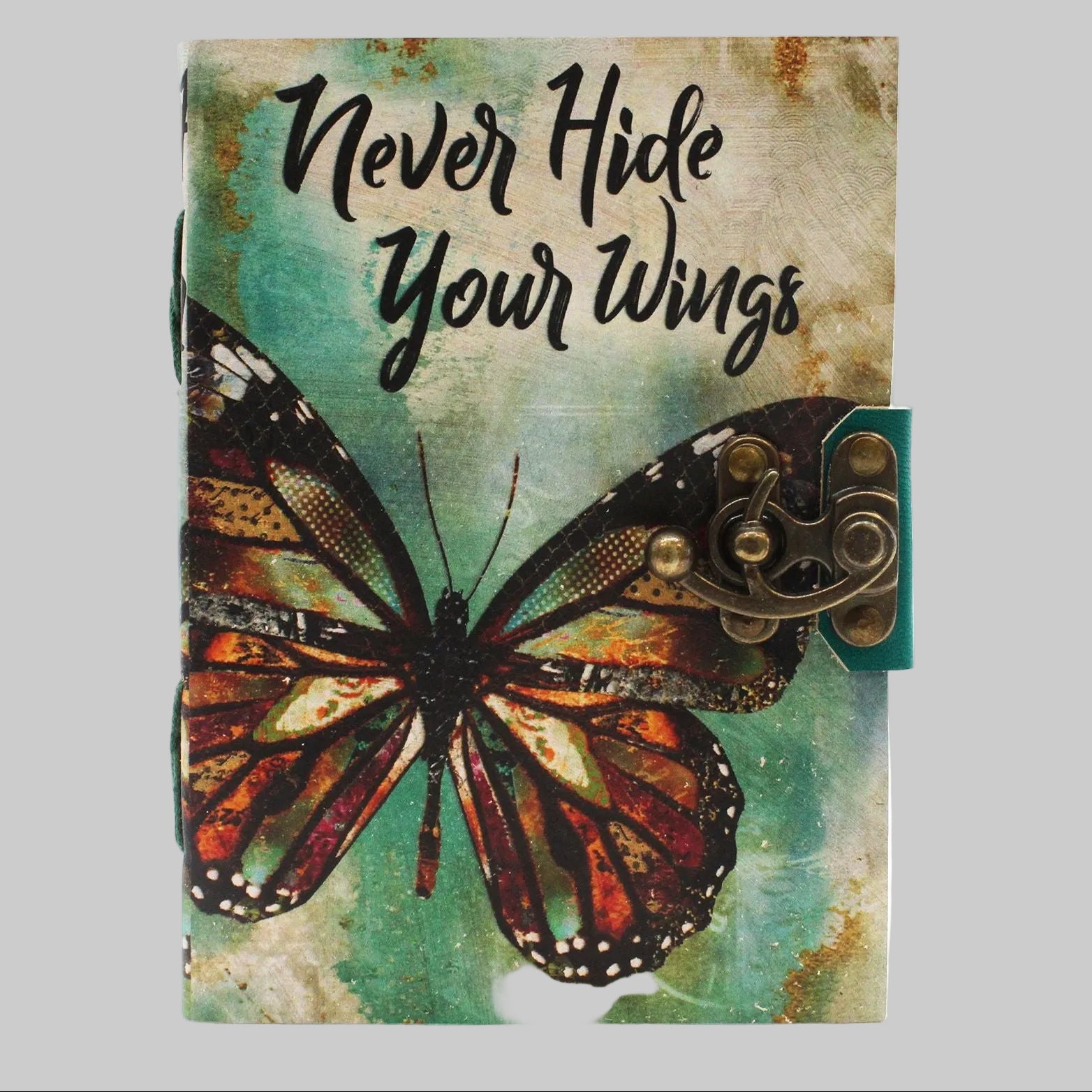 Notebook with butterfly design and 'Never Hide Your Wings' text on a textured background