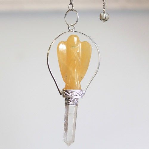 Crystal pendant with angel figure and clear base on a white background