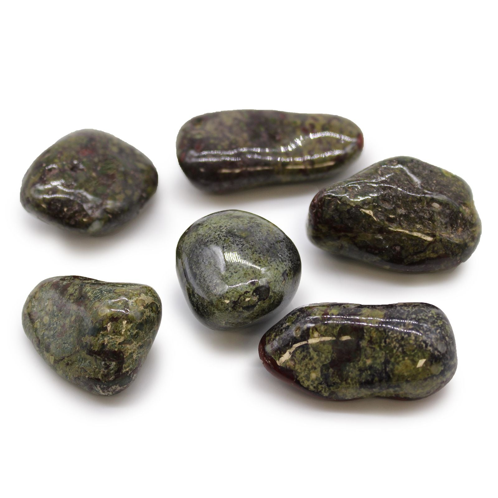 Six polished green stones on a white background
