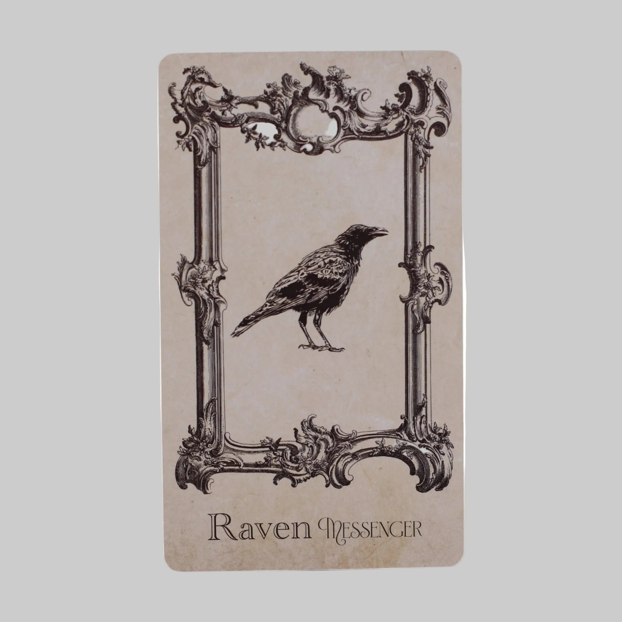 Notebook with a crow illustration and decorative frame on beige paper