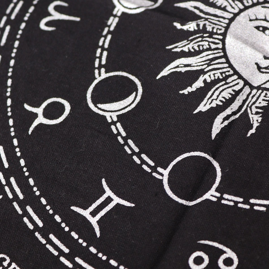 Black fabric with white astrological symbols and signs.