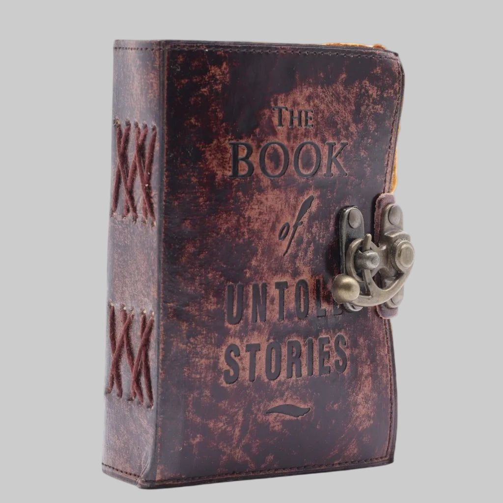 Decorative notebook titled 'The Book of Untold Stories' with a锁在封面上.