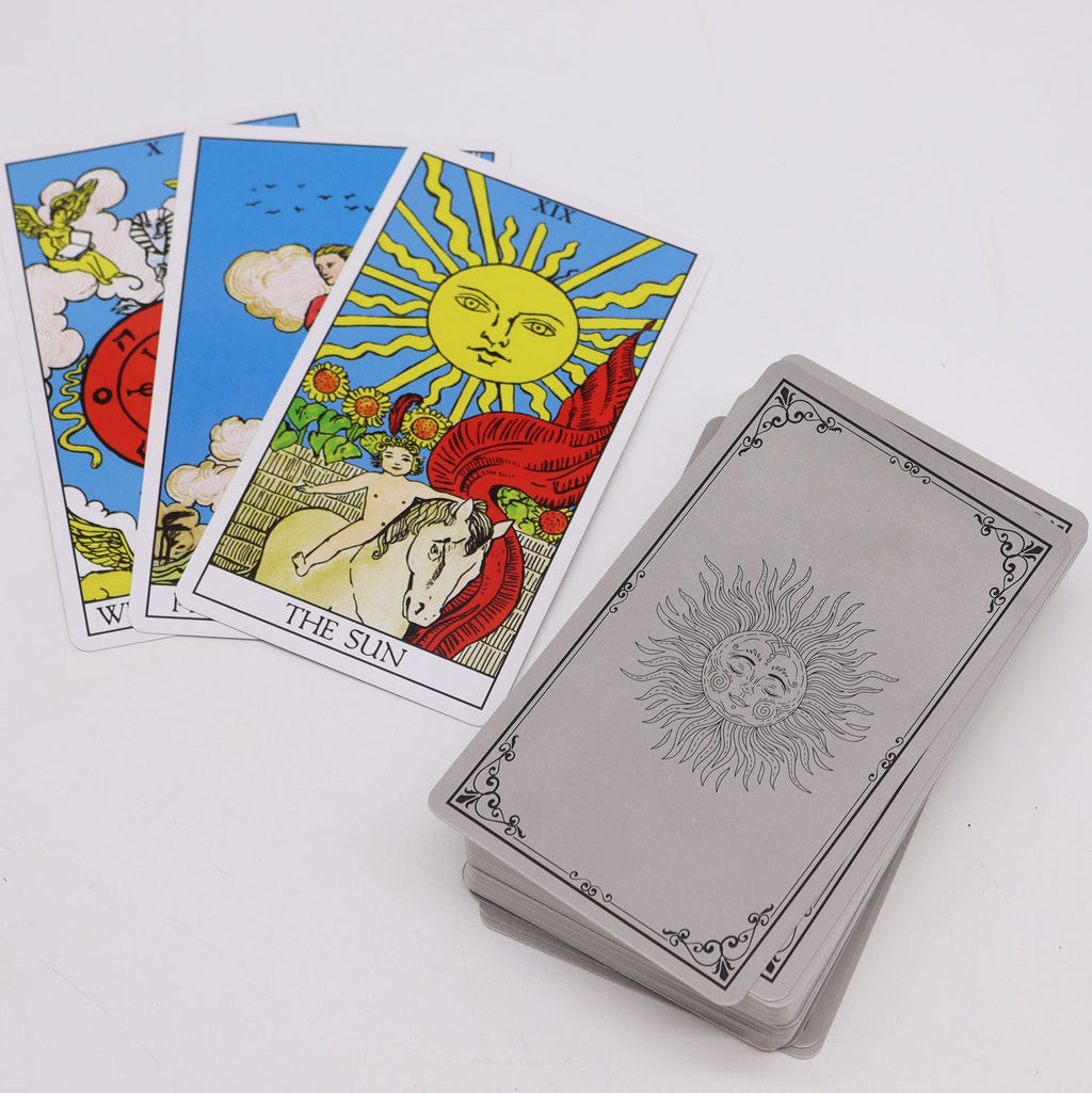 Tarot cards with 'The Sun' card on a white background