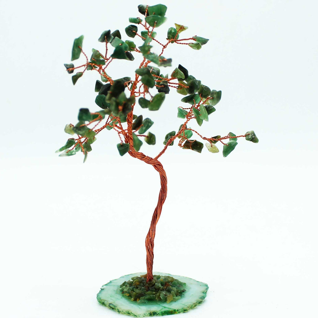Decorative tree made of green stones on a white background
