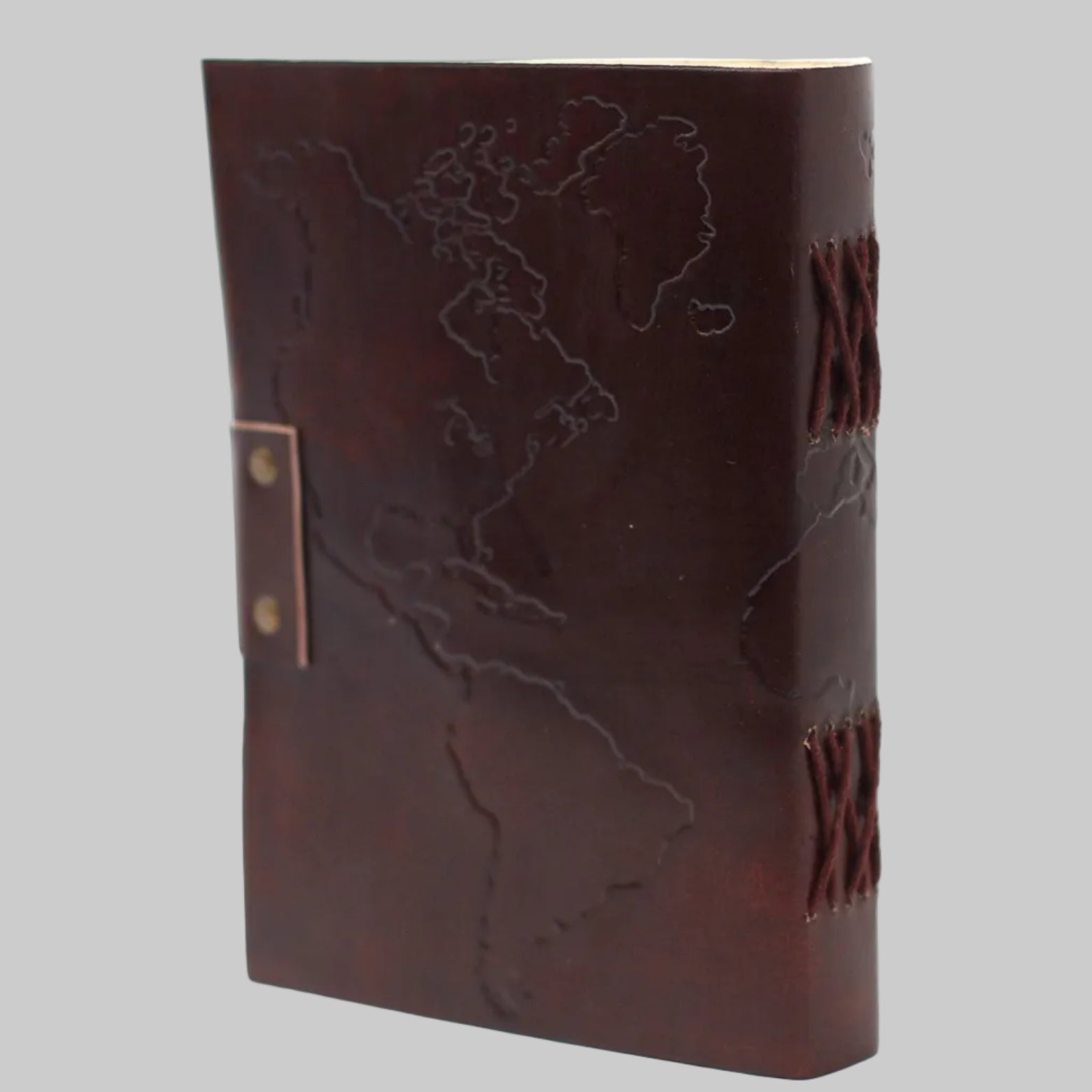 Brown leather notebook with world map design on a white background
