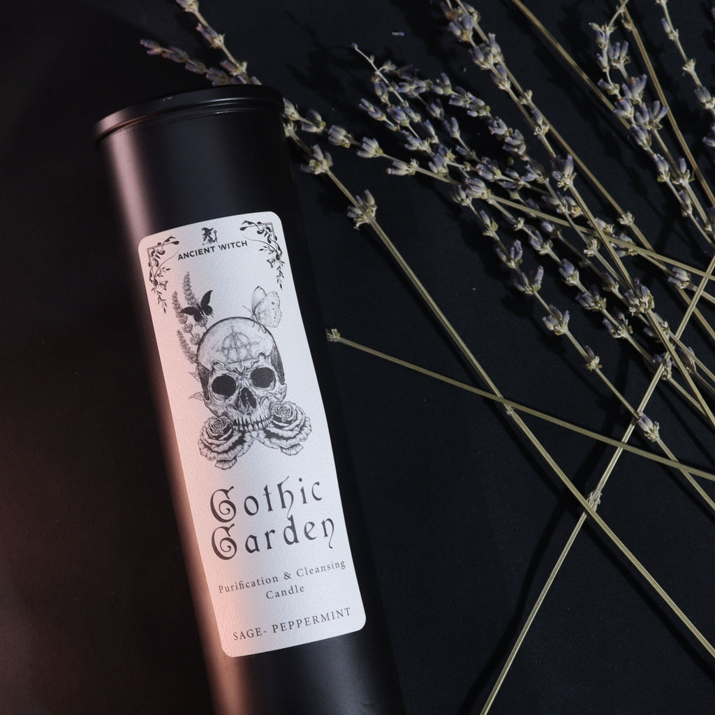 Candle with 'Gothic Garden' label on a black background with lavender.