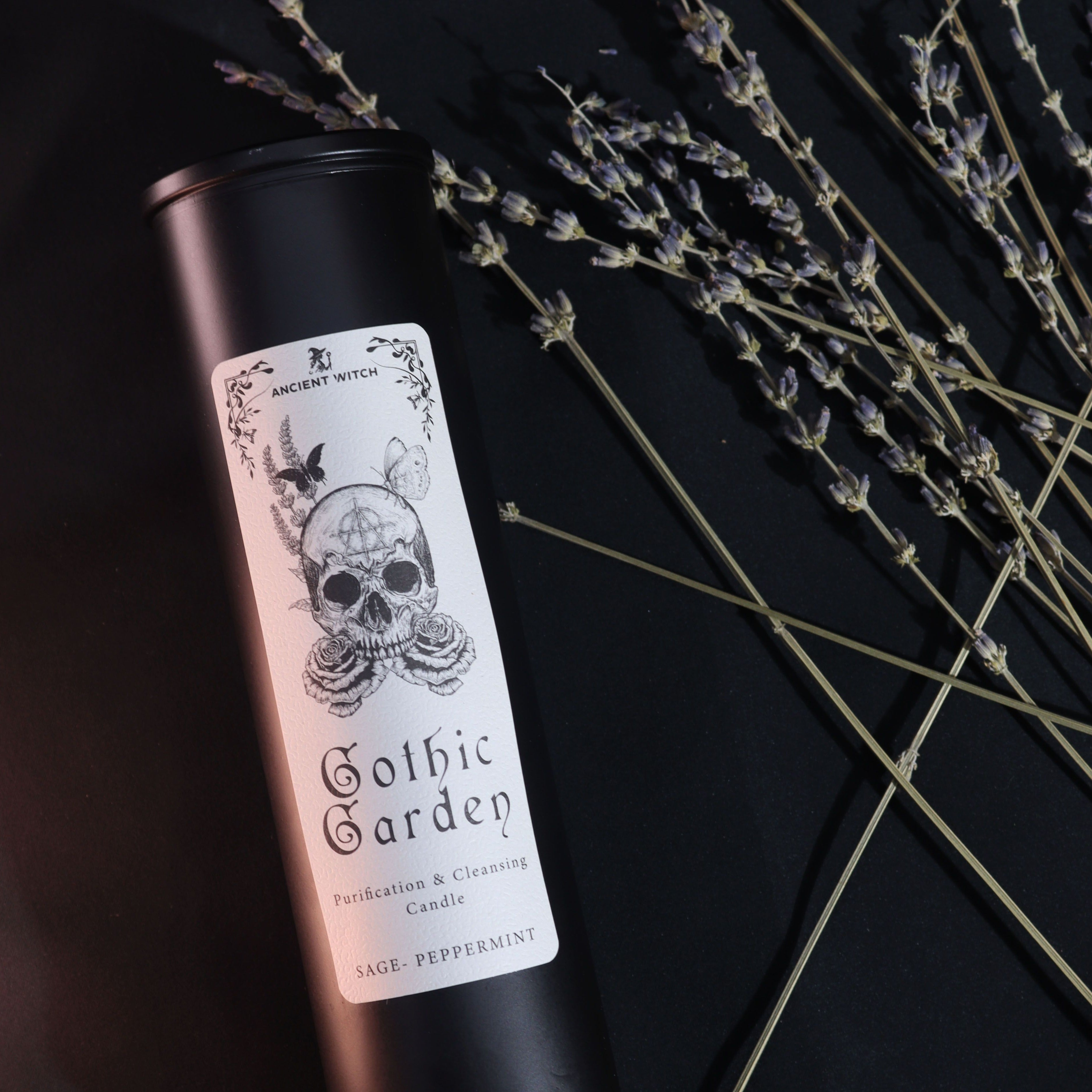 Candle with 'Gothic Garden' label on a black background with lavender.