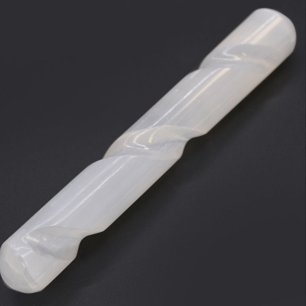 White plastic tool on a black background