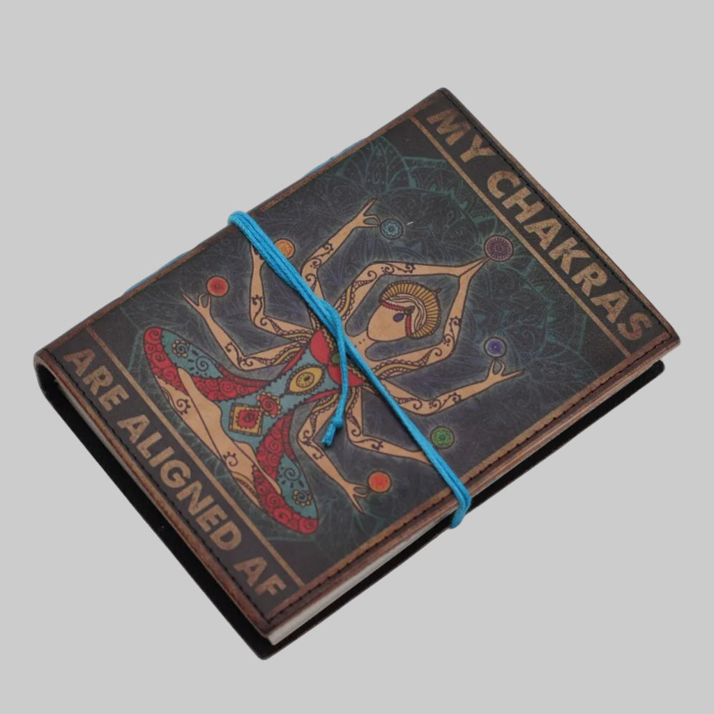 Decorative notebook with artistic design and text on a white background