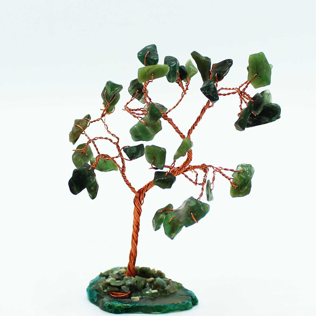 Decorative tree with green stone leaves on a white background