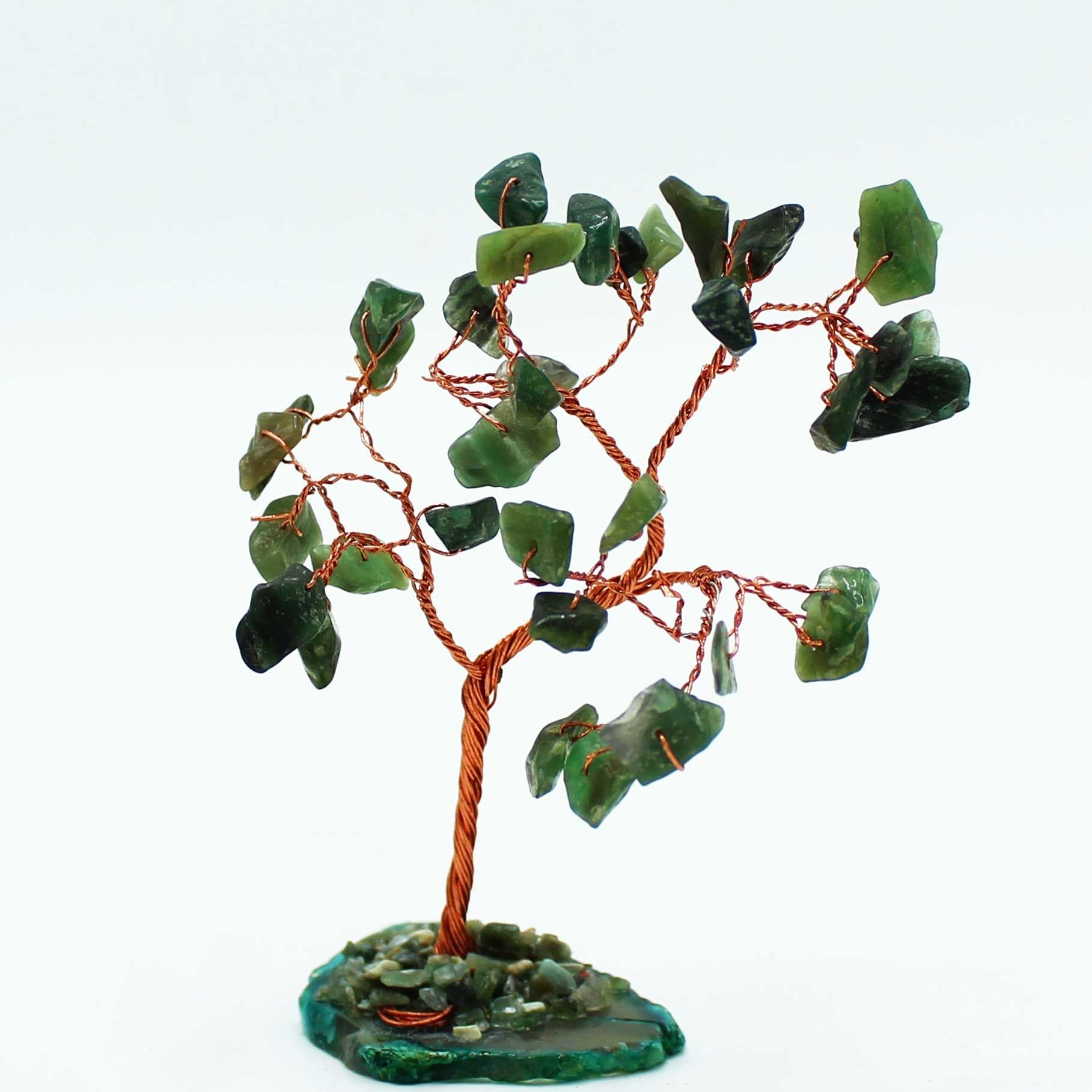 Decorative tree with green stone leaves on a white background