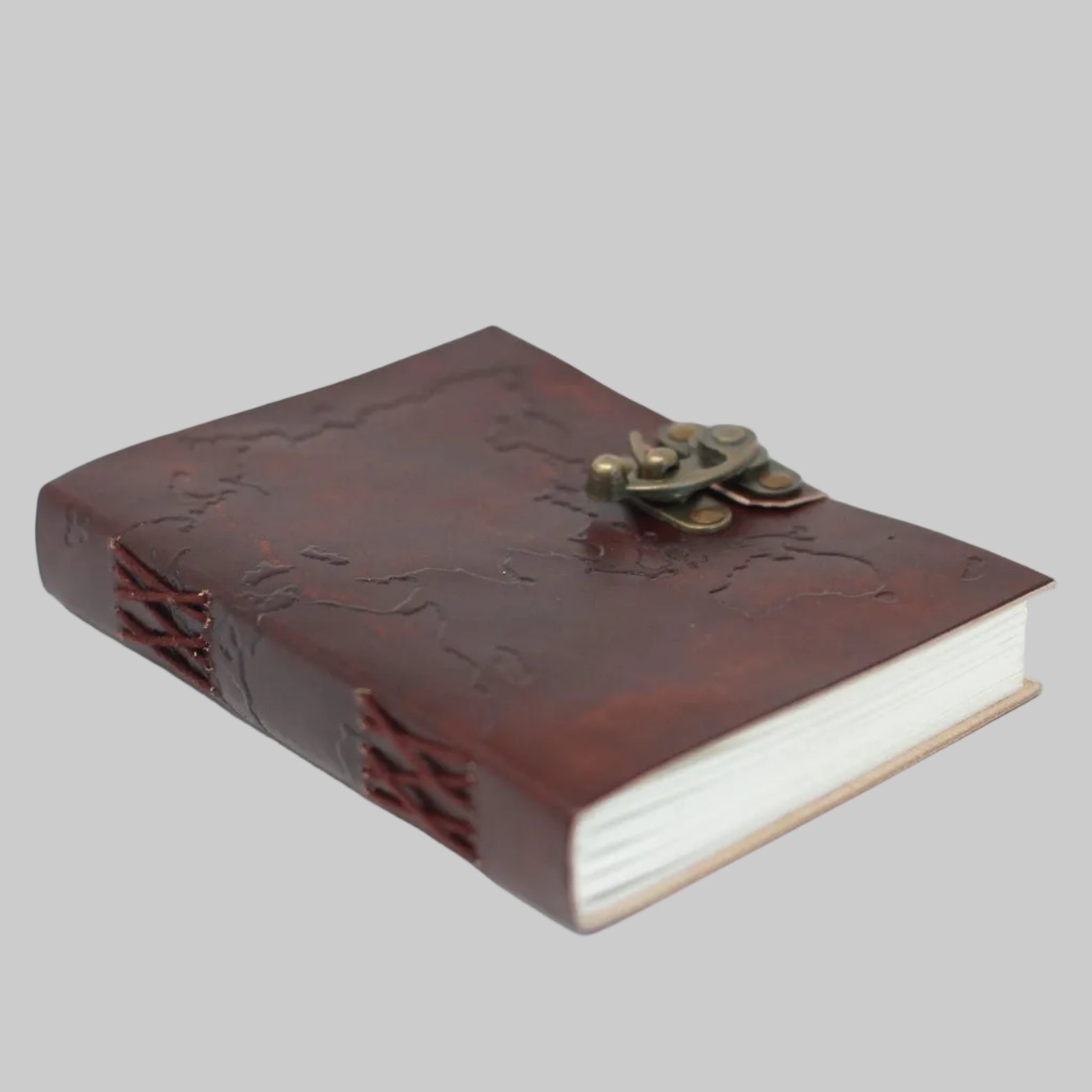 Brown leather notebook with a brass clasp on a white background