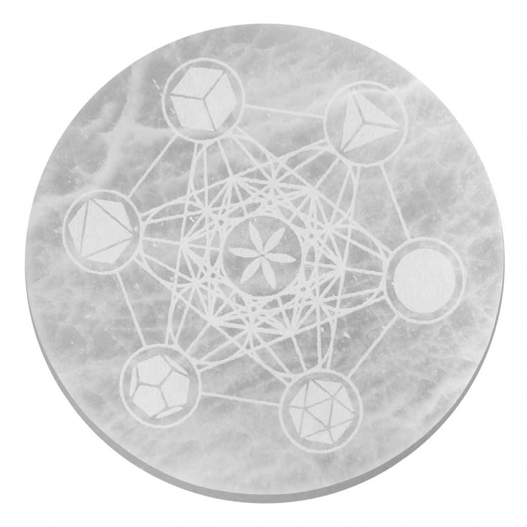 Round stone with geometric etchings on a white background