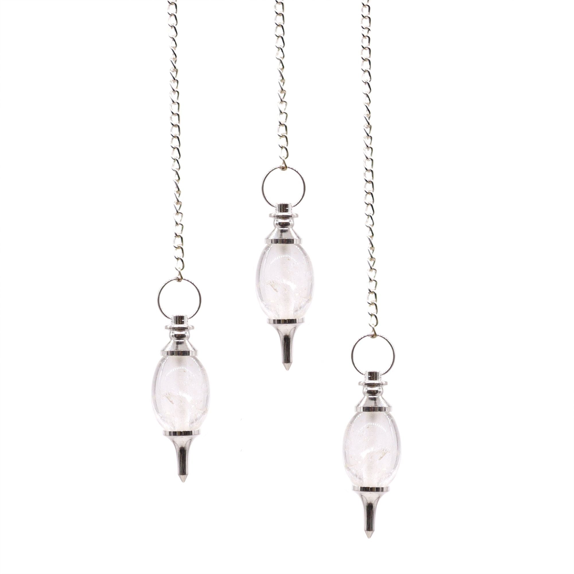 Three hanging glass pendulums on chains against a white background