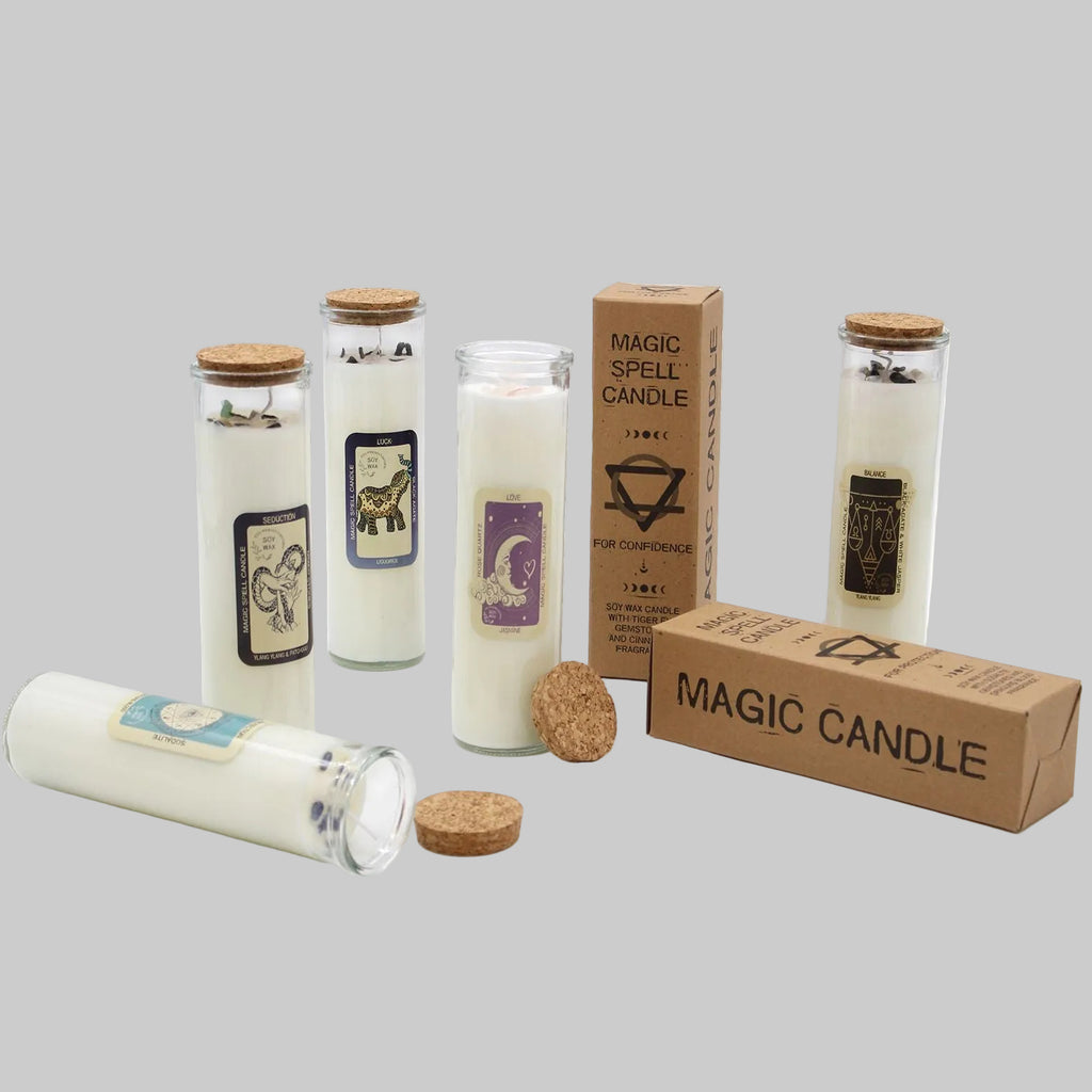 Set of magic candles with labels and packaging on a white background