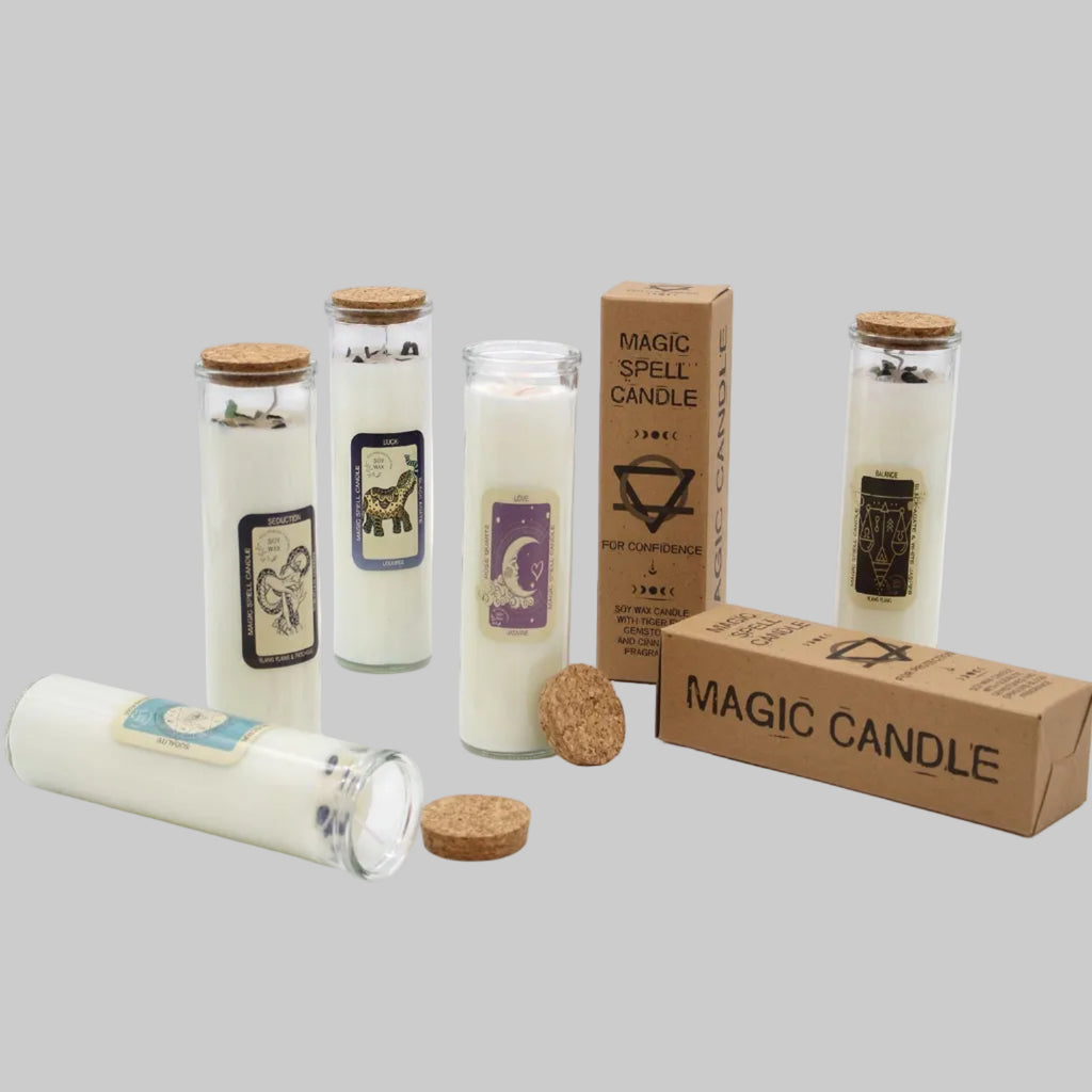 Set of magic candles with labels and packaging on a white background