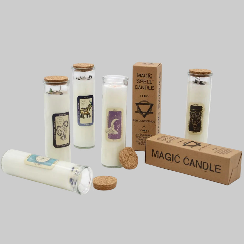 Set of magic candles with labels and packaging on a white background