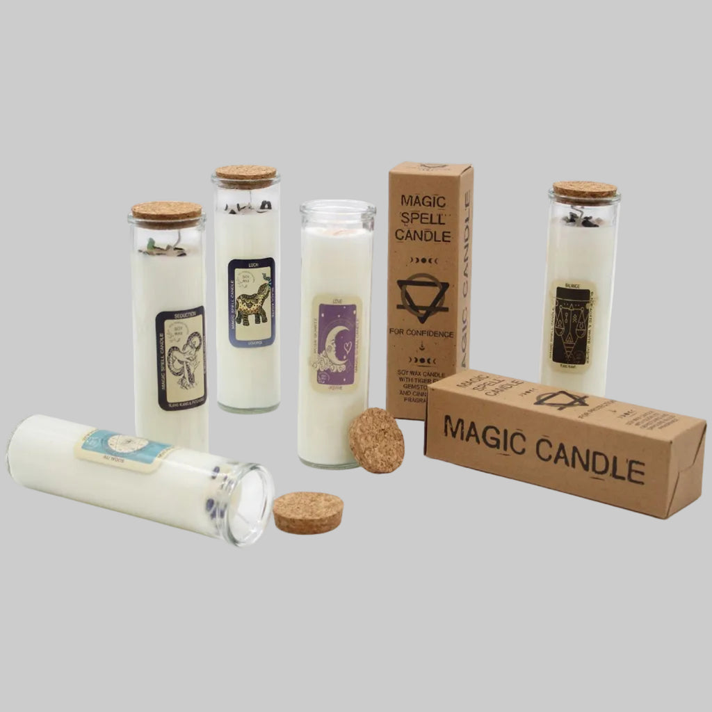 Collection of candles with labels and packaging on a gray background