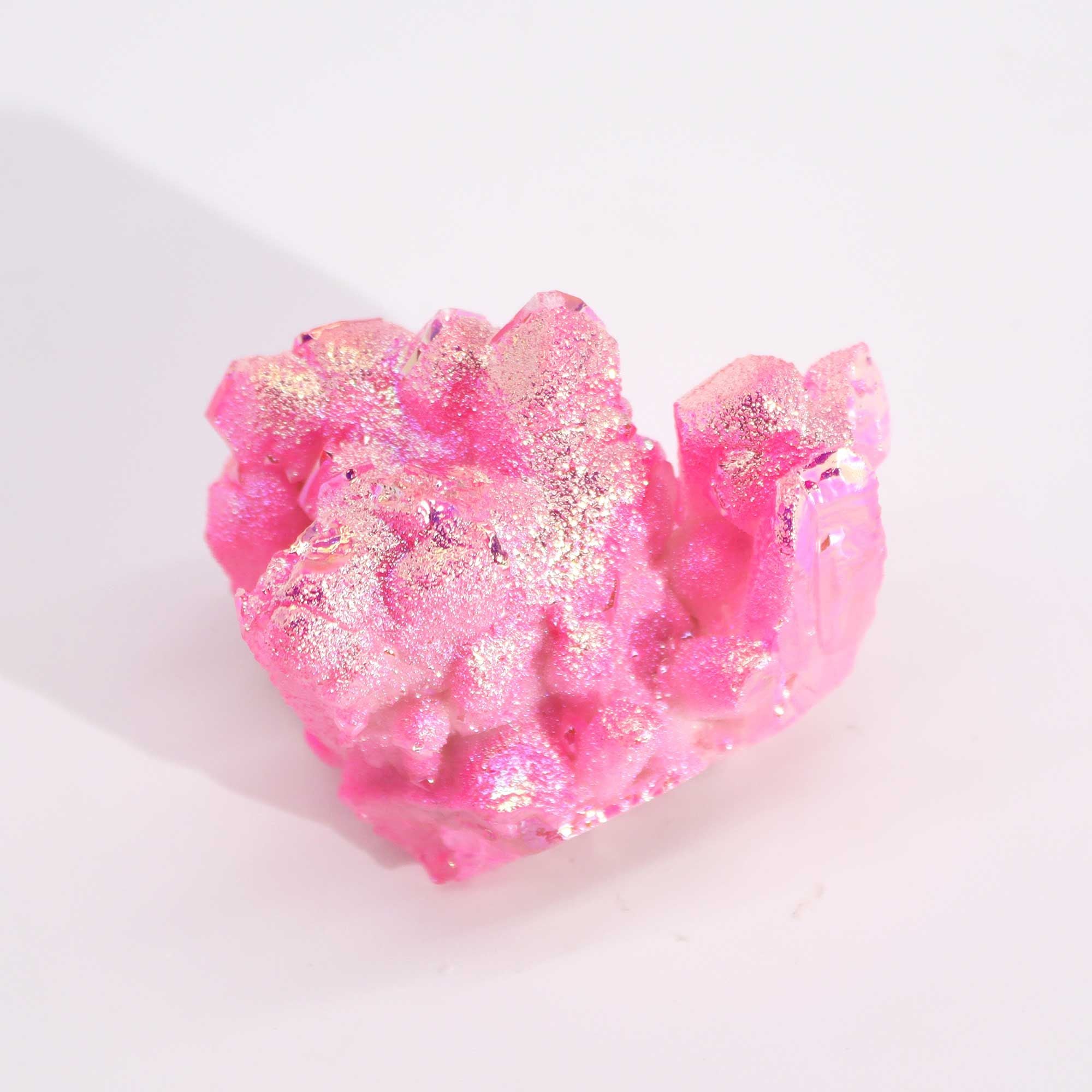 Pink crystal-like object on a white background