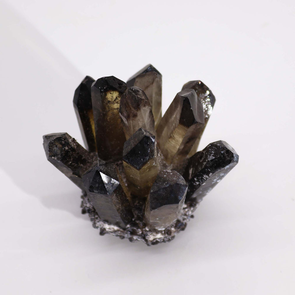 Smoky crystal cluster on a white background