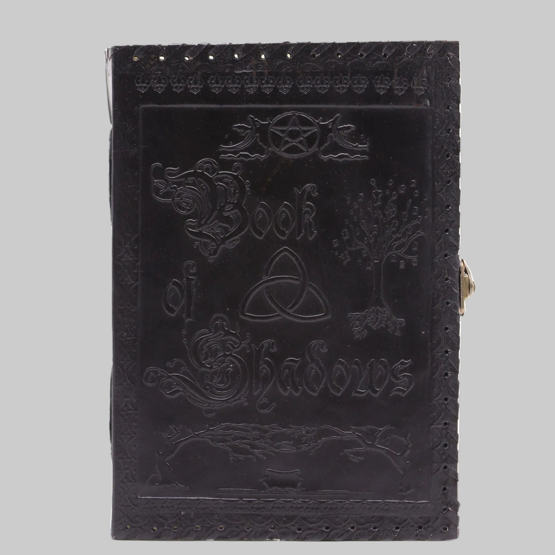 Black leather-bound book titled 'Book of Shadows' with embossed designs on a white background