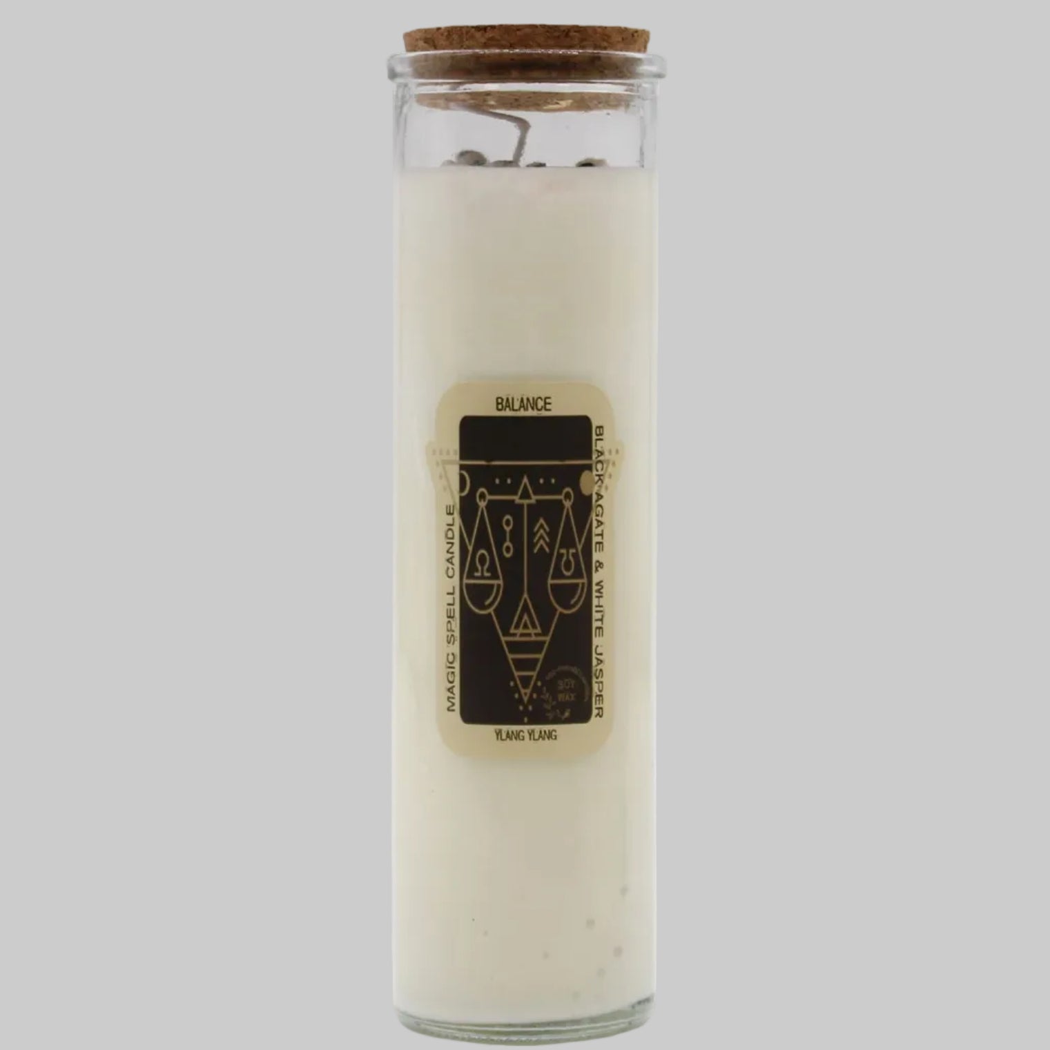 Glass candle with cork lid and label on a white background