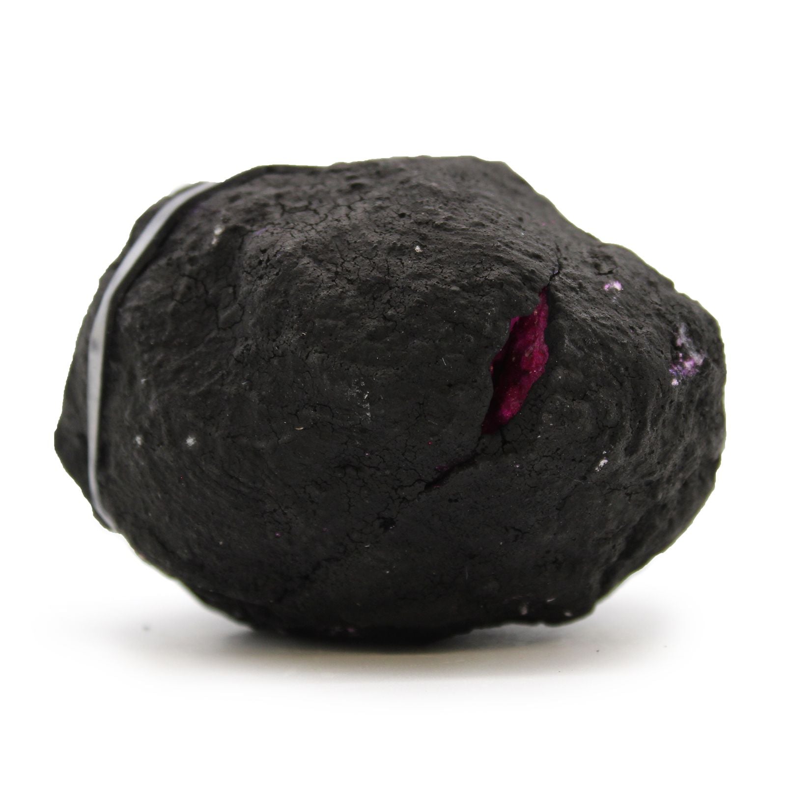 Black textured object with a pink interior on a white background