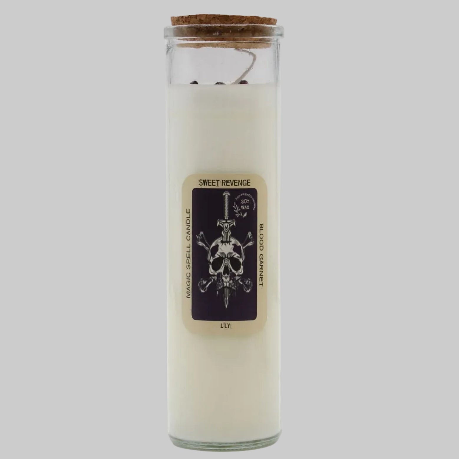 Glass candle with a label featuring a skull design on a white background