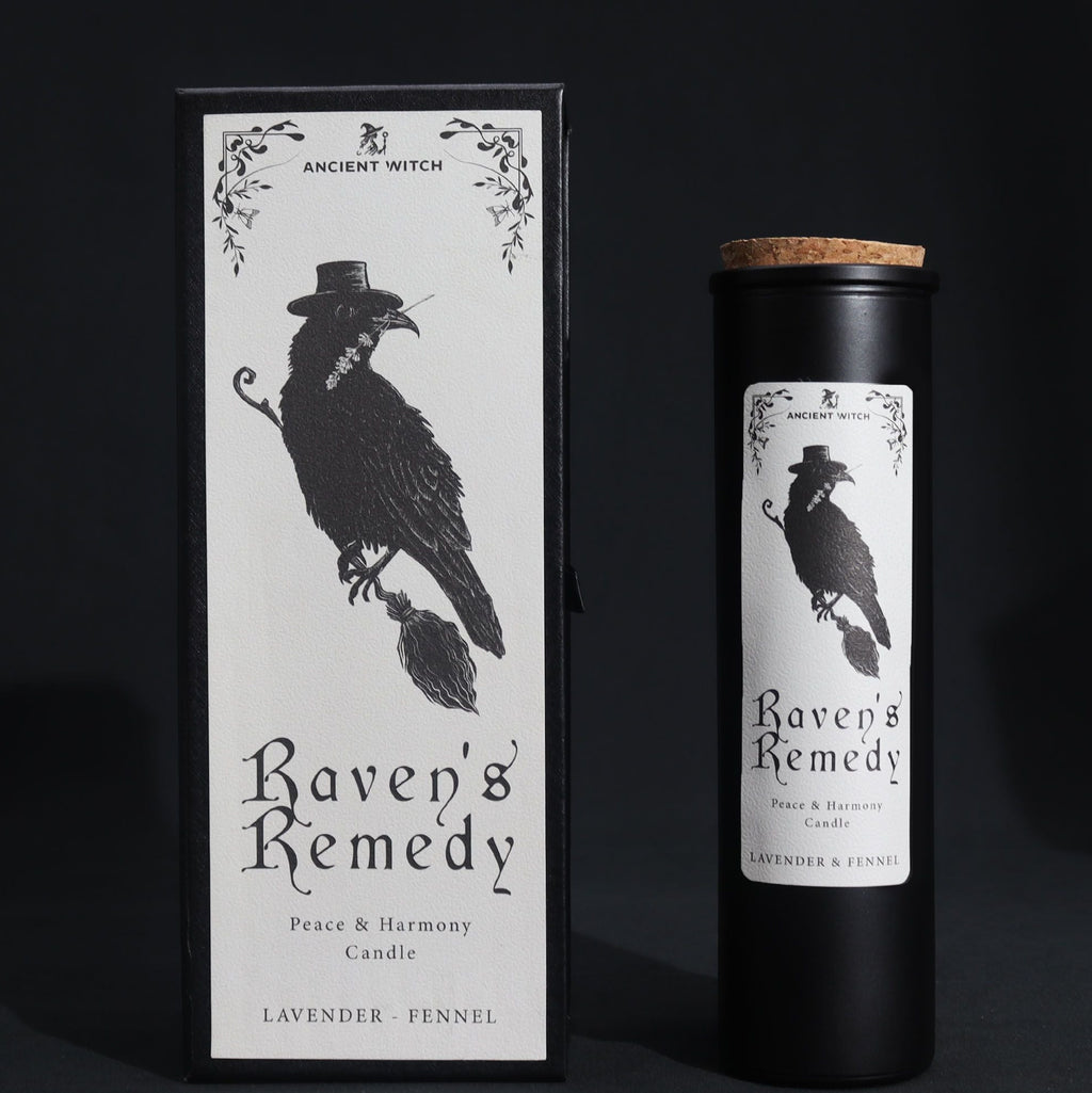 Candle packaging for 'Raven's Remedy' with a black and white design of a raven on a dark background.