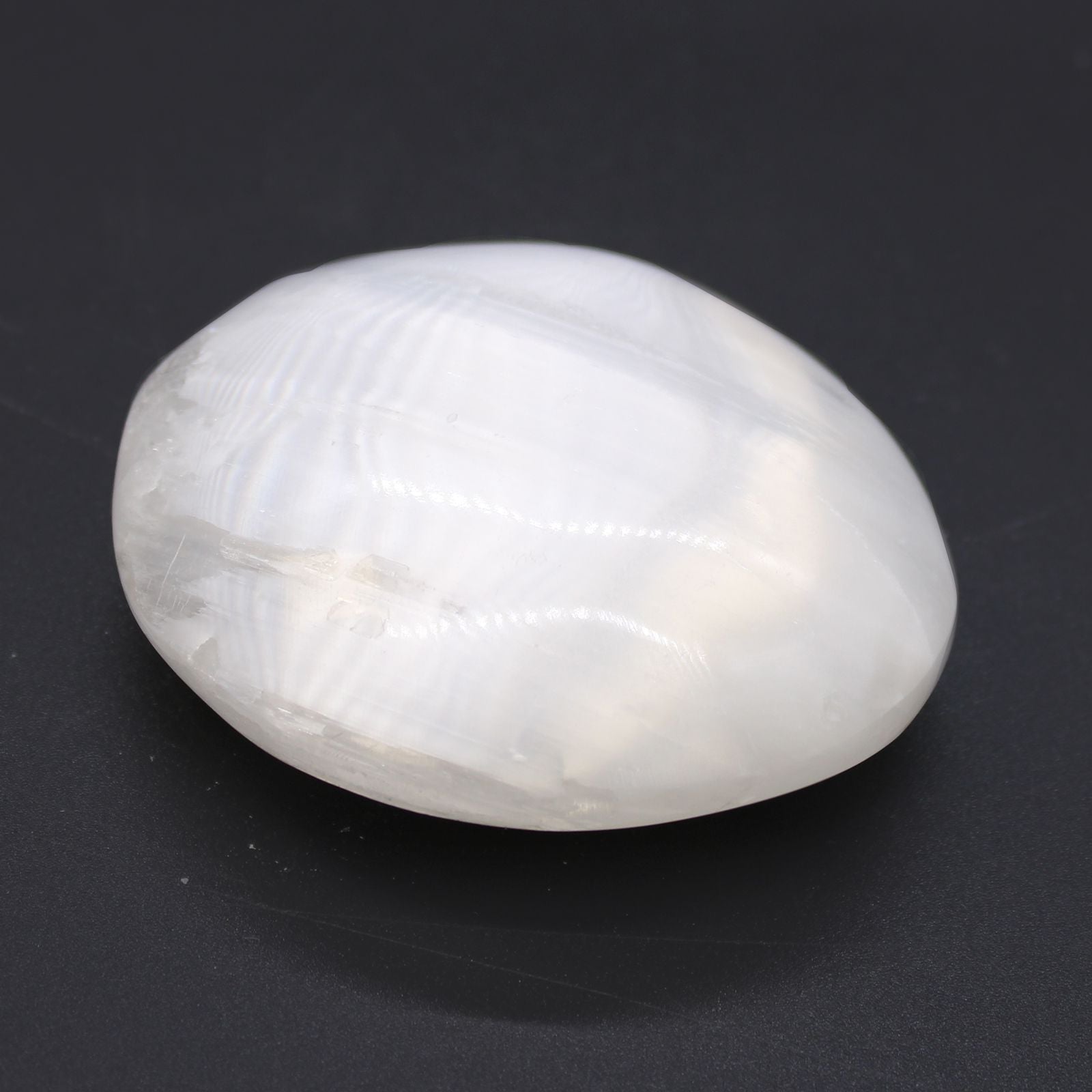 White stone with gray patterns on a black background