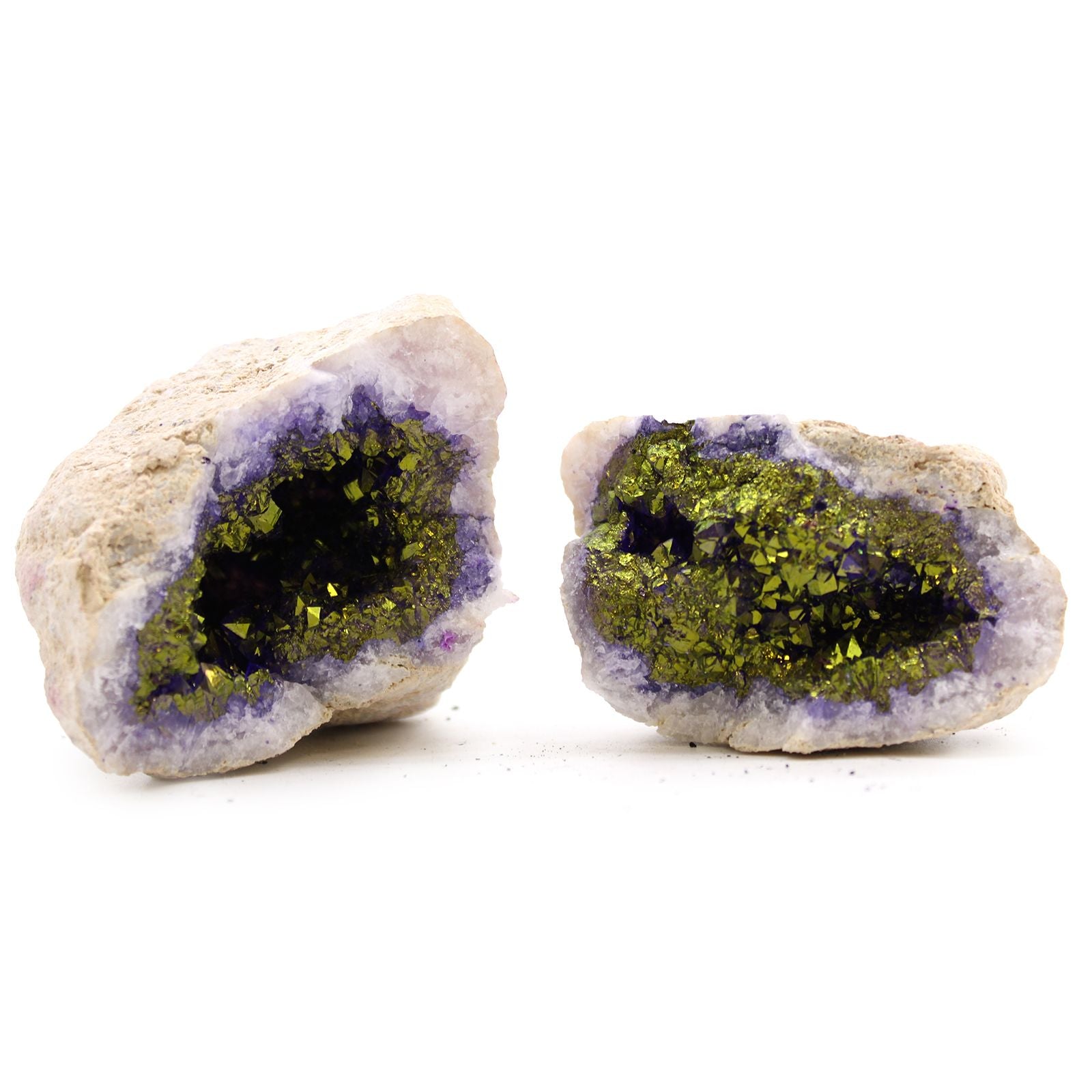 Two geode crystals with green and purple interior on a white background