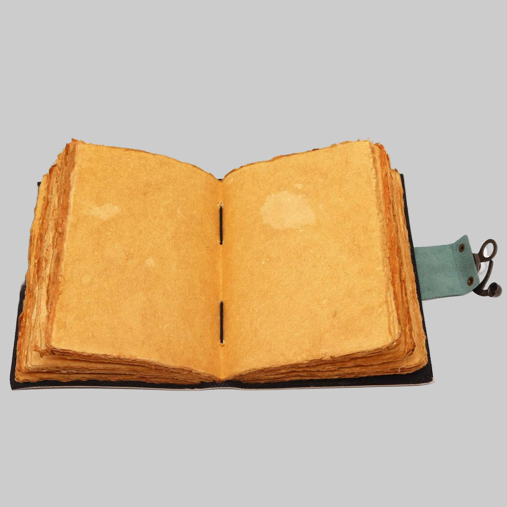 Open book with yellowed pages on a white background