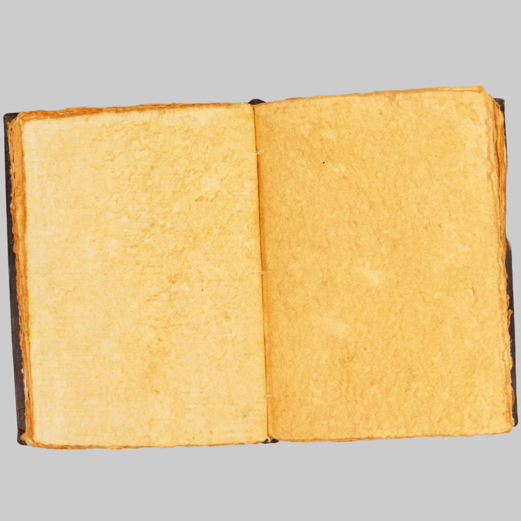 Open book with yellowed pages on a white background