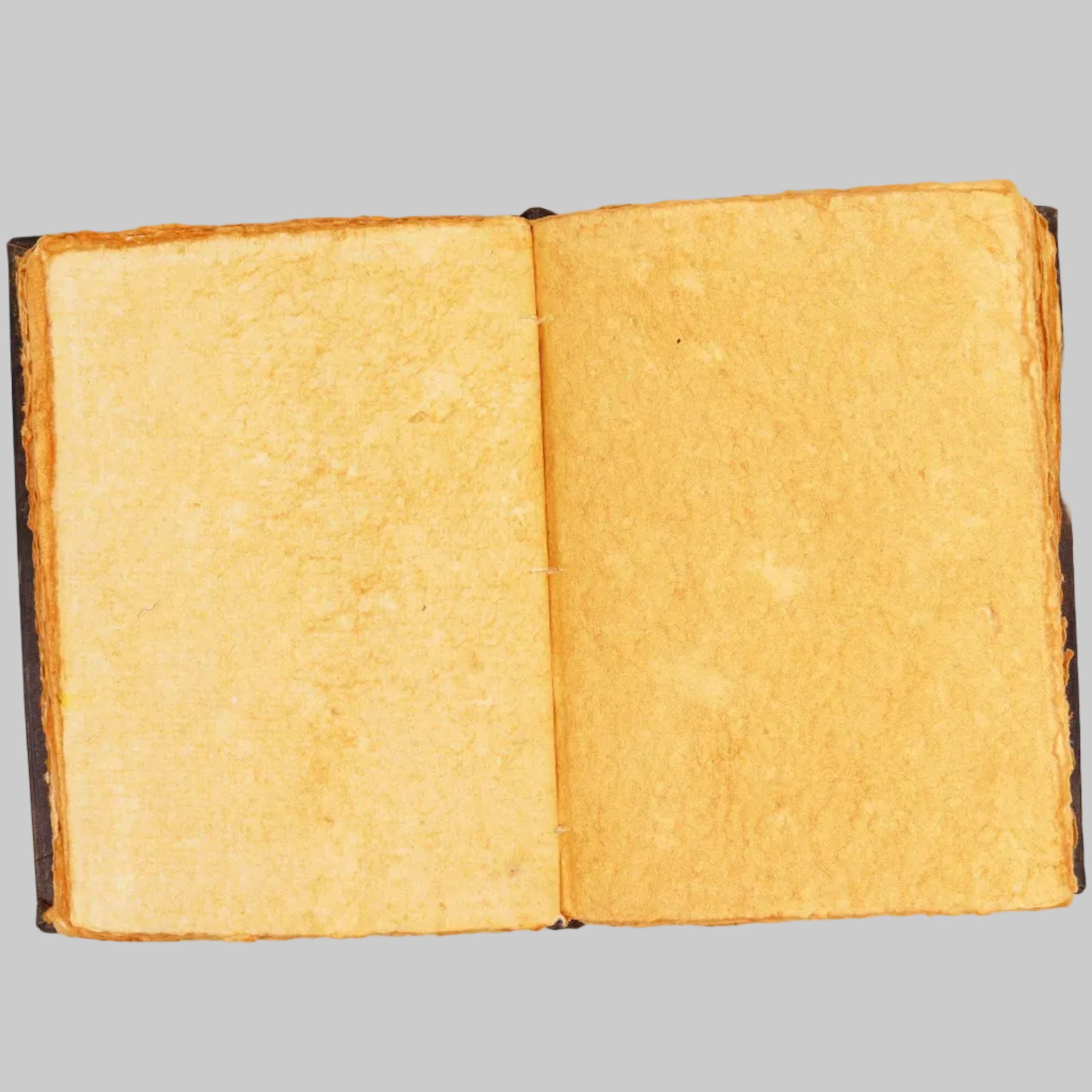 Open book with yellowed pages on a white background
