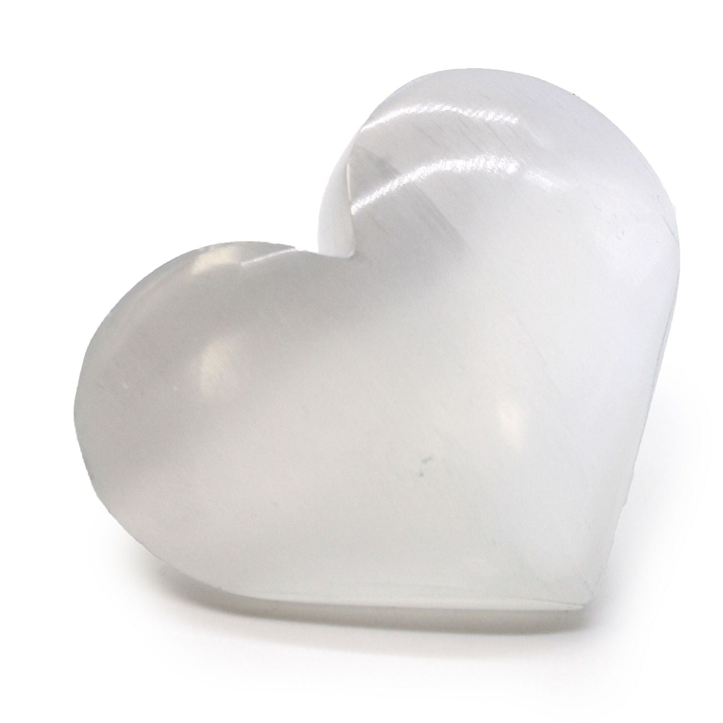 White heart-shaped object on a white background