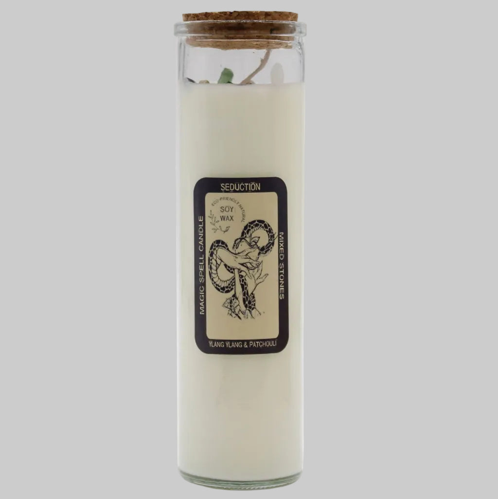 Scented candle in a glass jar with a label on a white background