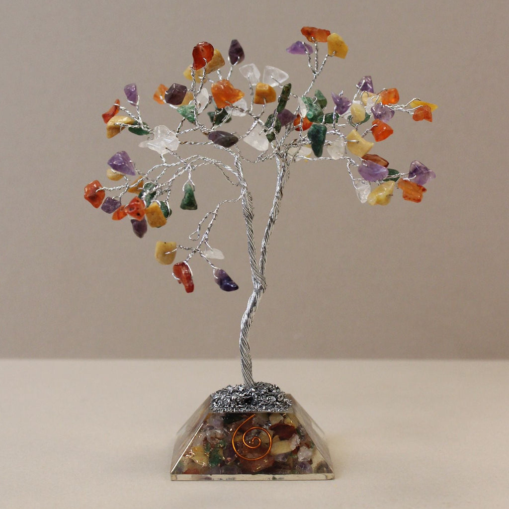 Crystal tree with multicolored stones on a beige background