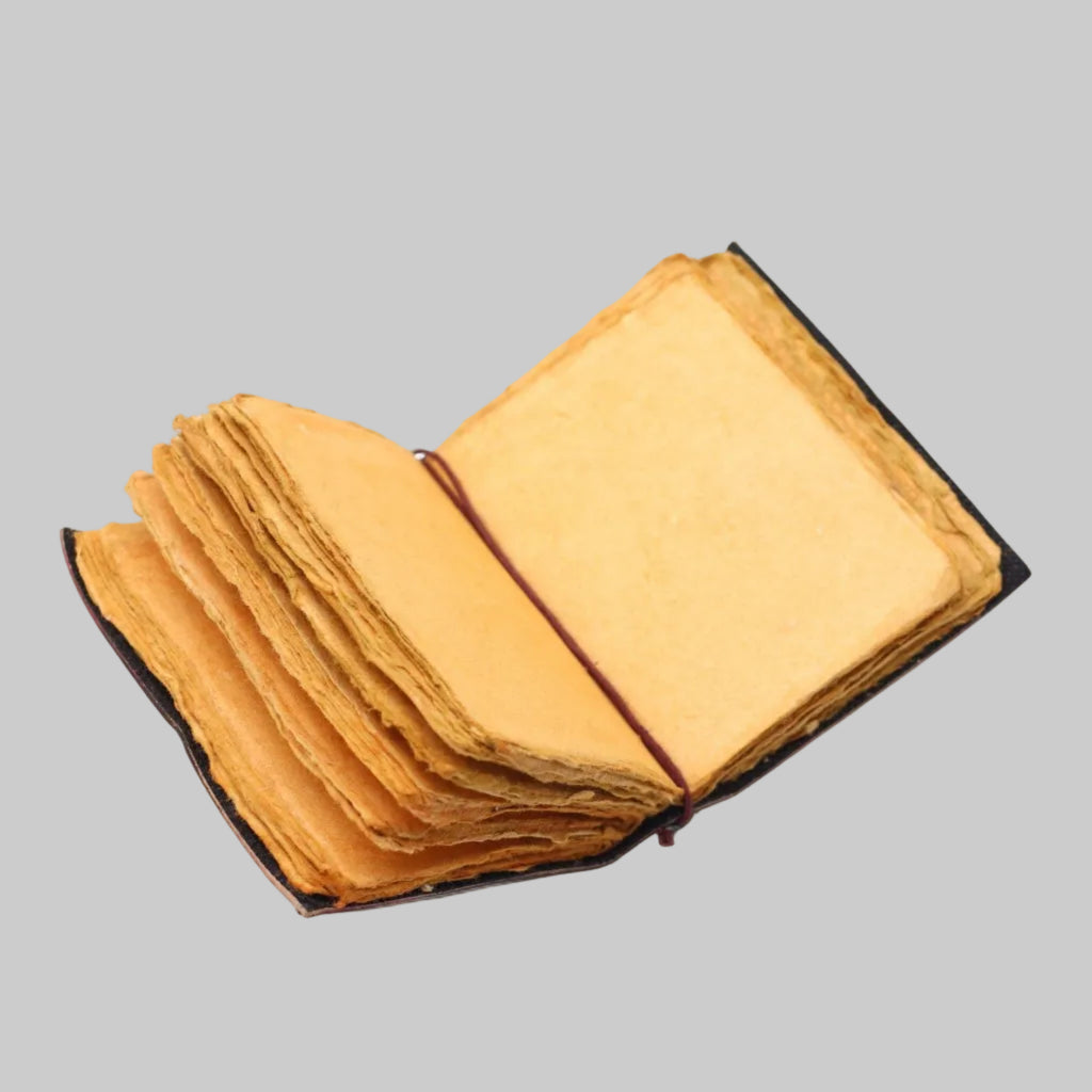 Open book with yellowed pages on a white background