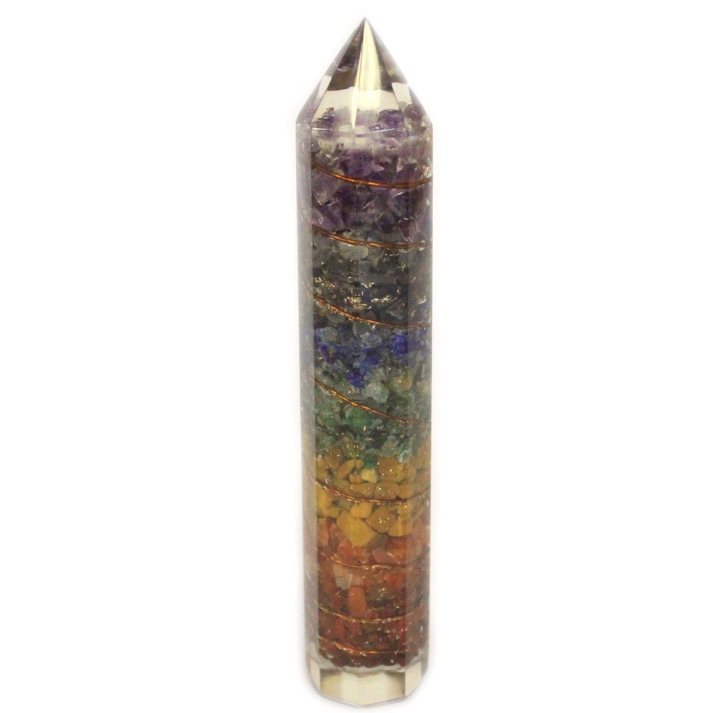 Multicolored crystal tower with a metallic top on a white background