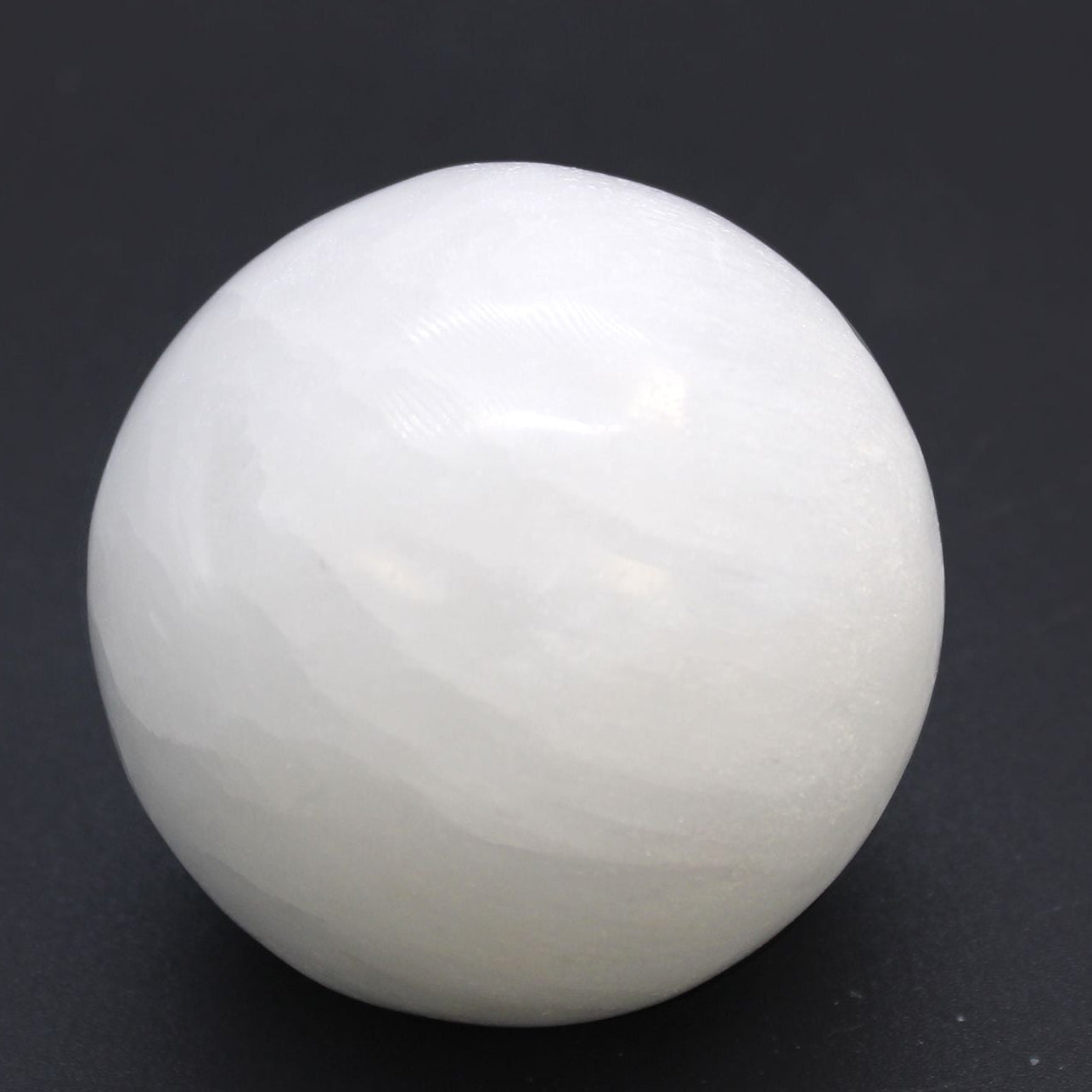 White sphere on a black background