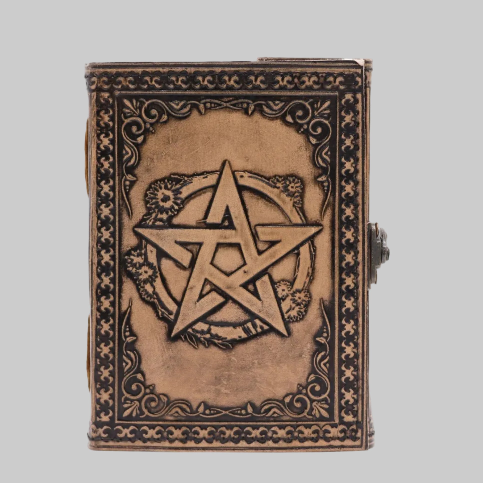Decorative book with a pentagram design on a white background