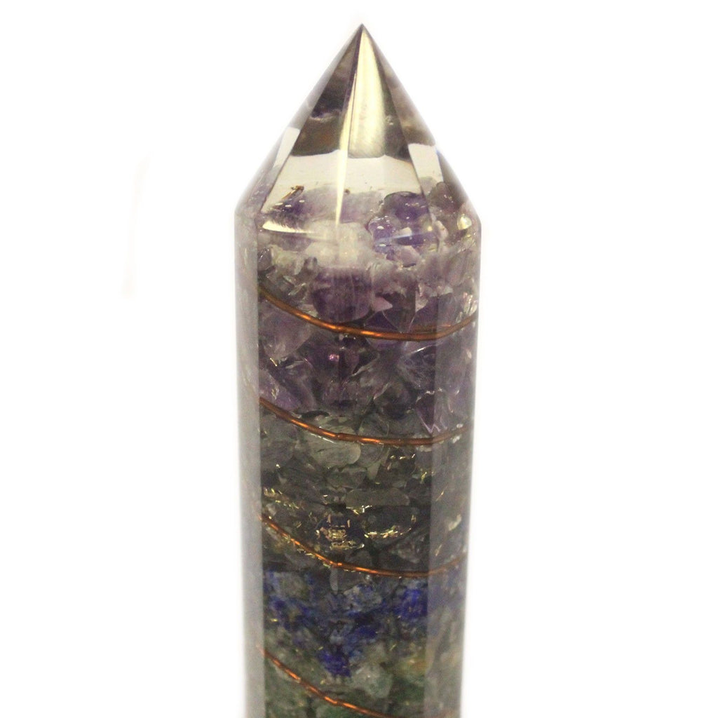 Crystal tower with layered stones on a white background