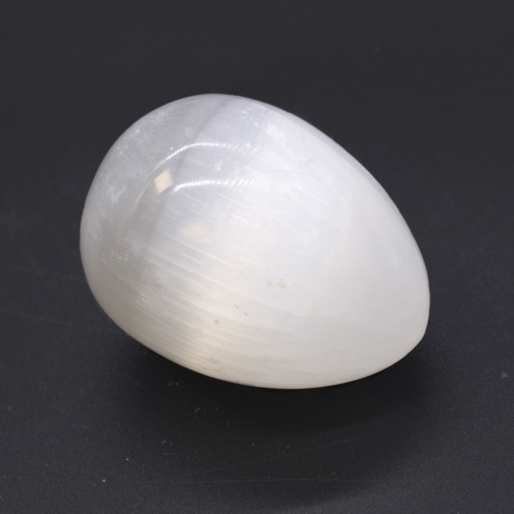 White cat's eye gemstone on a black background